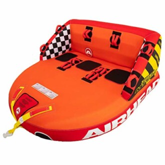 Airhead inflatable towable tube with checkered and striped design.