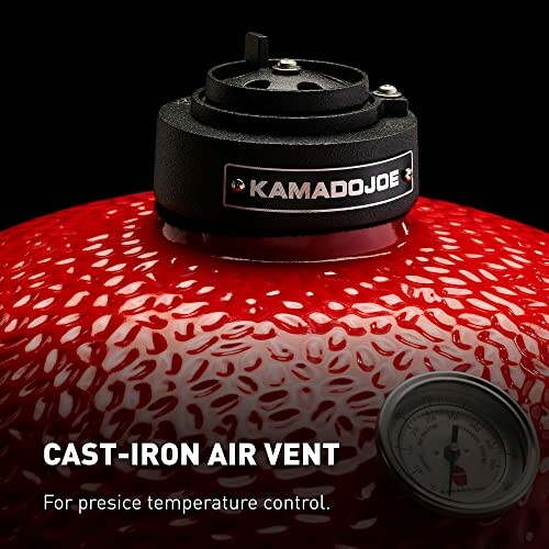 Kamado Joe grill with cast-iron air vent for temperature control.