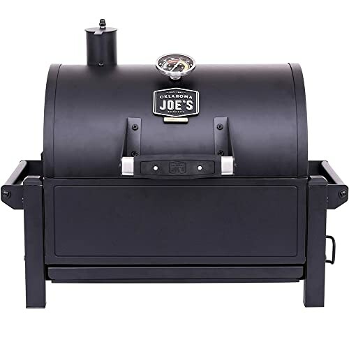 Oklahoma Joe's portable charcoal grill with lid and temperature gauge.