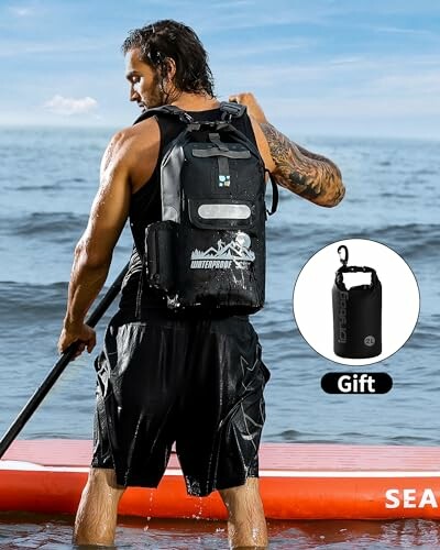 Person paddleboarding with a waterproof backpack in the ocean.