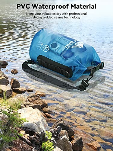 Blue waterproof dry bag on rocky lakeside.